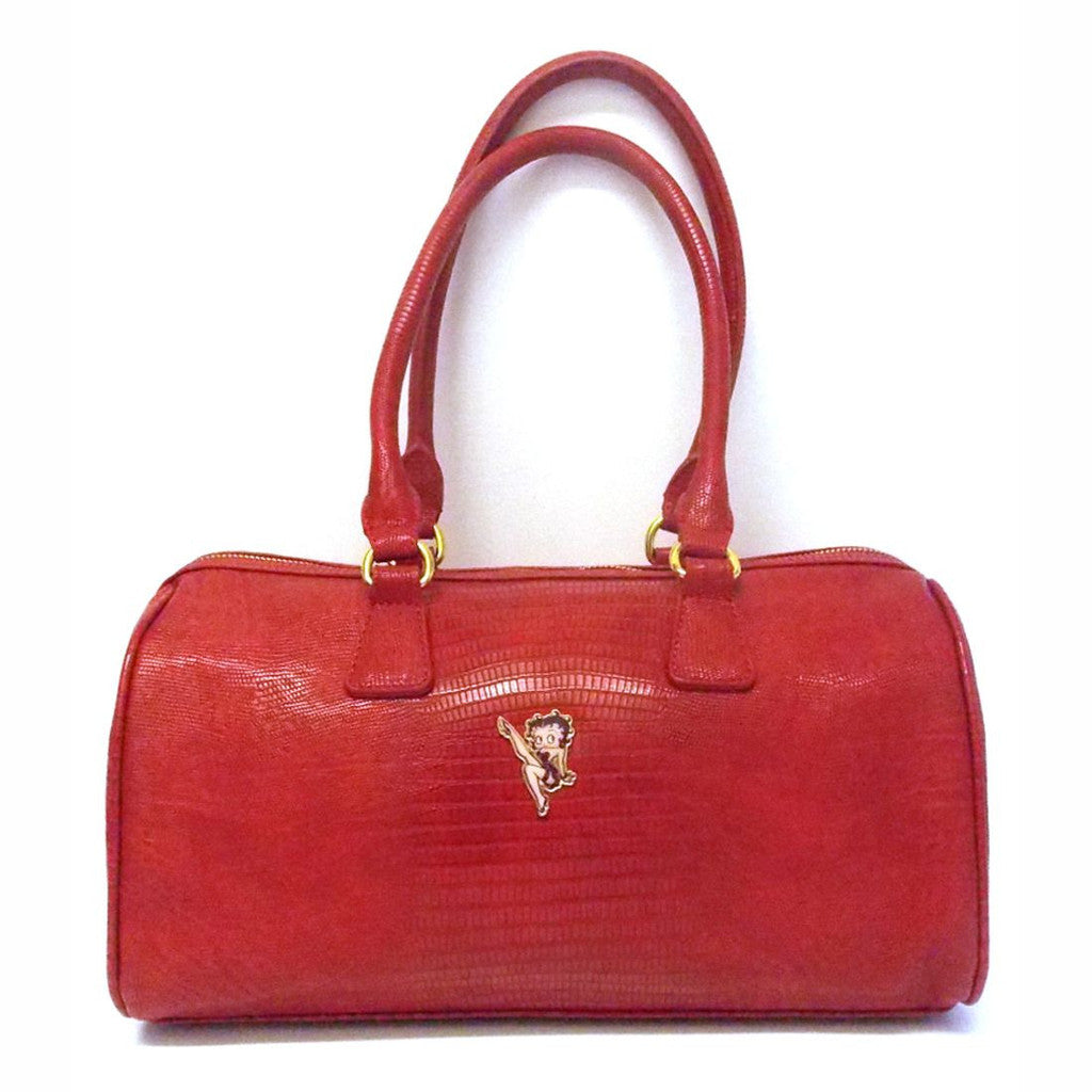 Betty Boop Classic Red Handbag Betty Boop Classic Red Handbag is a hard shell bag with zip closure, with shoulder strap and can be handheld as a shoulder bag. It made of PU leather with natural skin effect. Exclusively Available at Reliance Gifts www.reliancegifts.co.uk