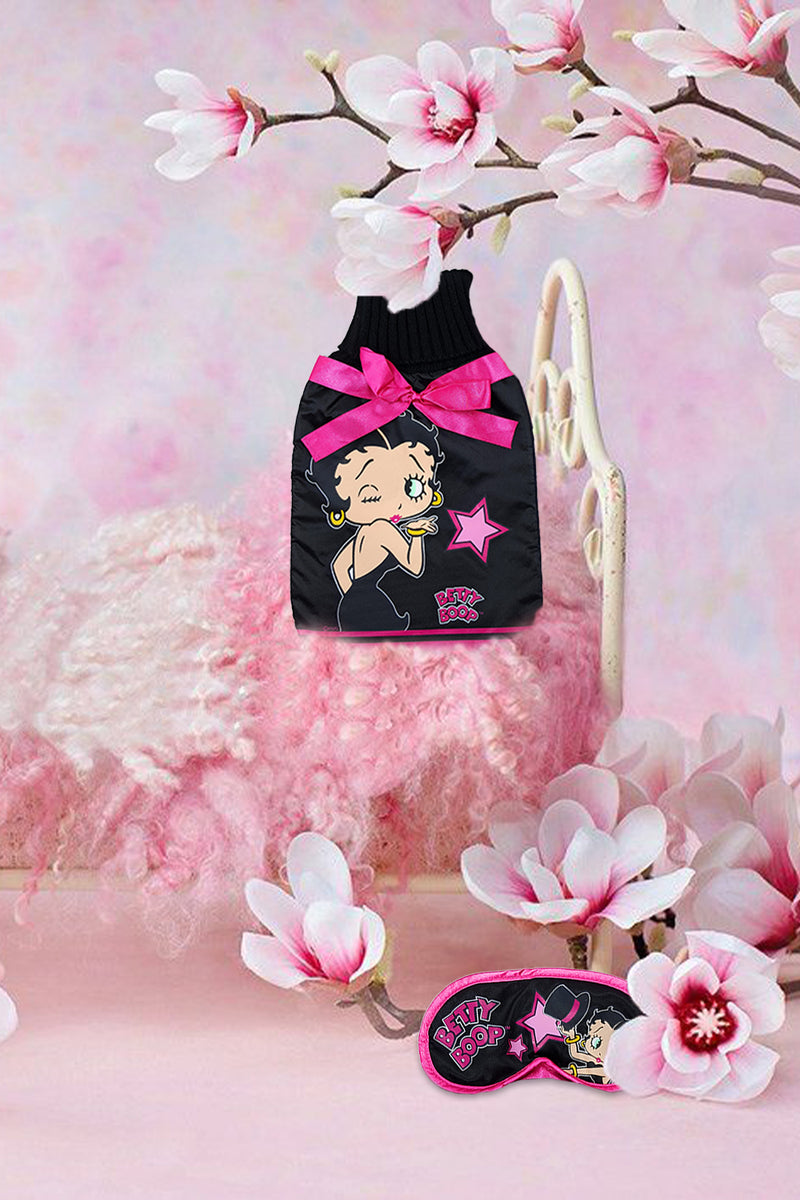 Show off your official Betty Boop cute Hot water bottle with the pretty cover and matching Betty Boop eye mask at your next pyjama party! A Betty Boop showgirl hot water bottle in black with pink ribbon detail.  Ribbed cotton end and satin style finish.  Exclusively Available at Reliance Gifts www.reliancegifts.co.uk